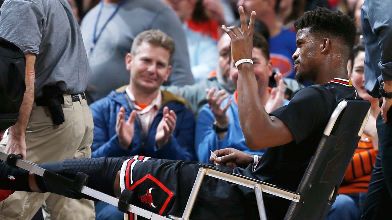 Bulls' Jimmy Butler taken off court in wheelchair after hard fall